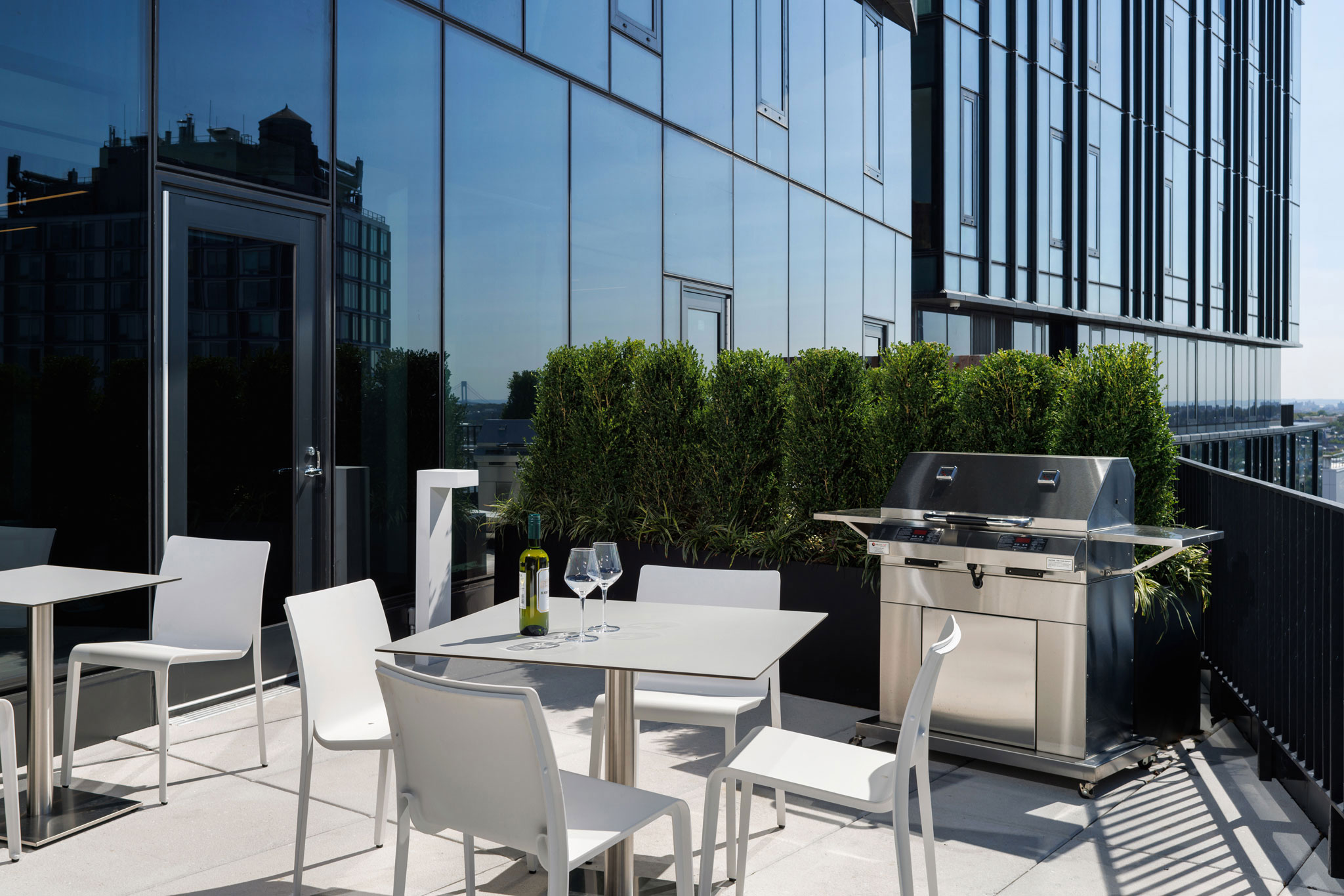 Brooklyn Crossing 27th floor amenity terrace with a grill for barbecuing